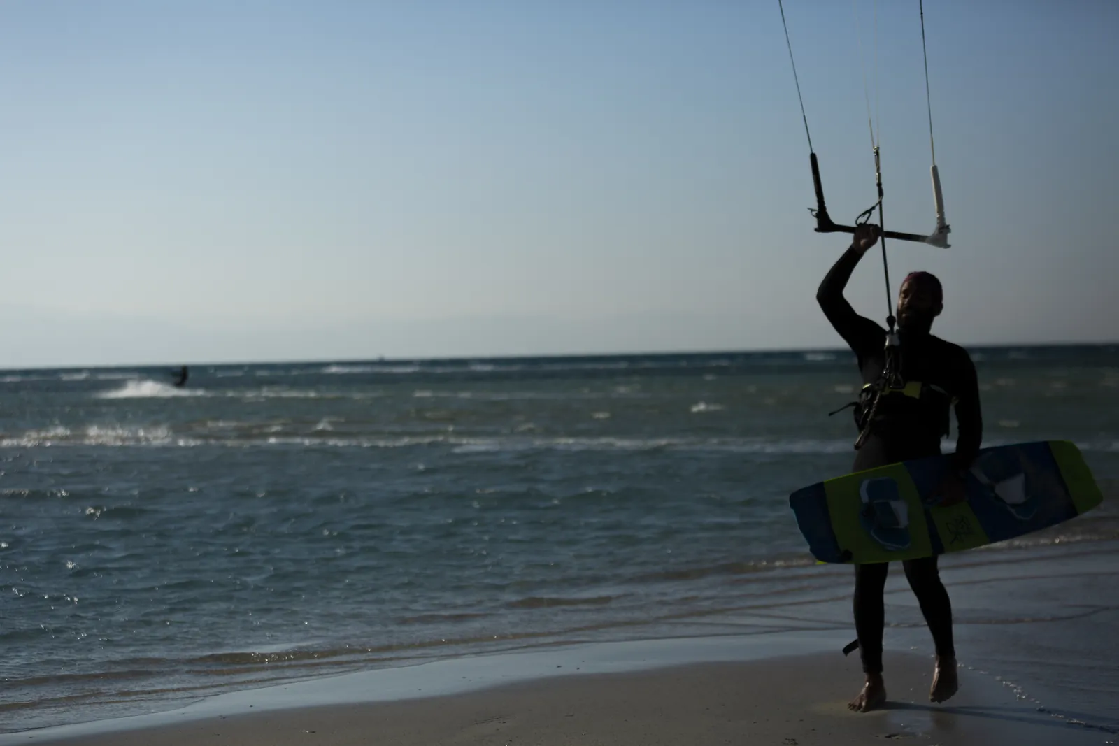 Kitesurfer silhouetted against the evening sea